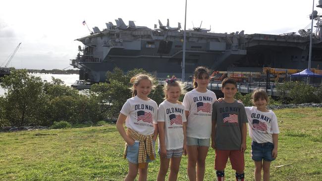 Children of US sailors await their father's arrival at the Port of Brisbane. Picture: Nicole Pierre