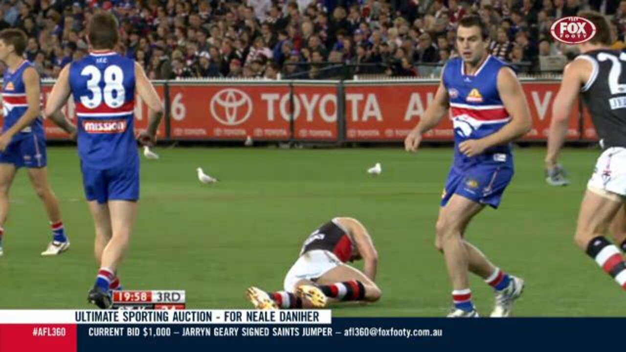 Brian Lake bumps Nick Riewoldt in 2009.