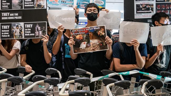 Protesters block the departure gate at the Hong Kong International Airport. Picture: Getty Images.