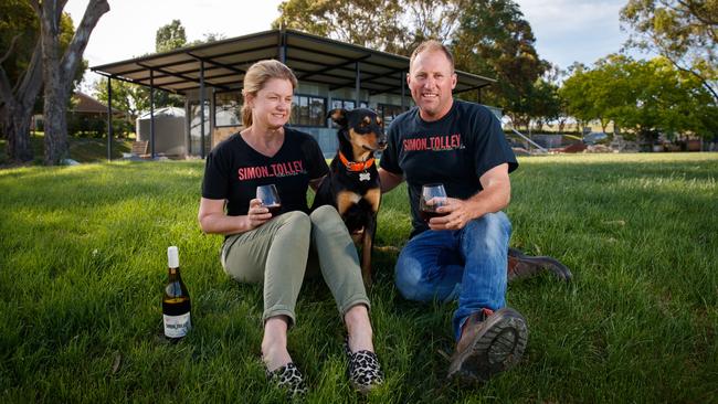 Simon and Narelle Tolley with their dog Tilly at the partially built cellar door of Simon Tolley Wines in Woodside. Picture Matt Turner.