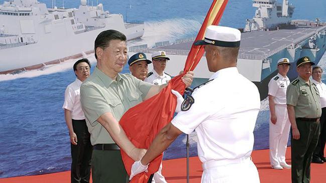 Xi Jinping attends the commissioning ceremony for three naval vessels in April. Picture: CGNT