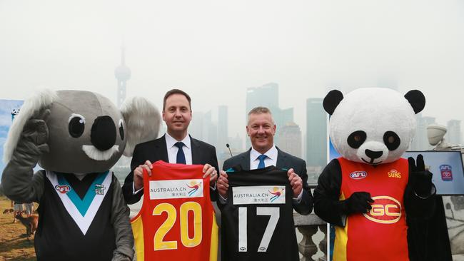 Steve Ciobo, MP (left) and AFL general manager of football operations Mark Evans are ready for the big game.