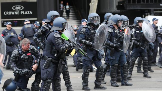 Police push protesters back on the Spencer st bridge. Wednesday, September 11. 2024. Picture: David Crosling