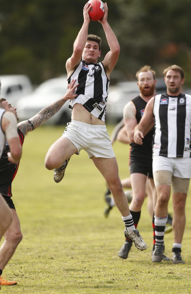 Darcy Kingsbury marks for Clayton before hurting his right ankle.