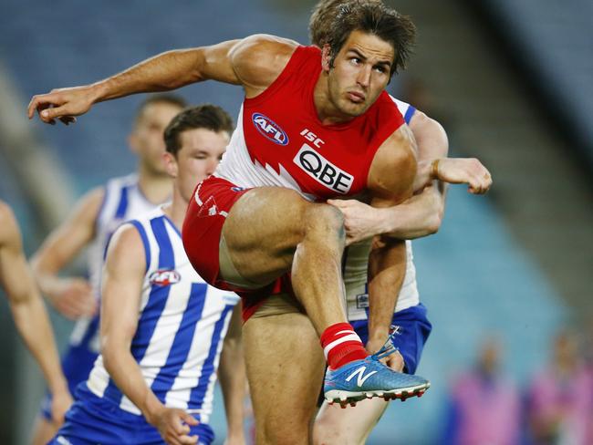 Josh Kennedy gets a kick away against North Melbourne. Picture: Michael Klein