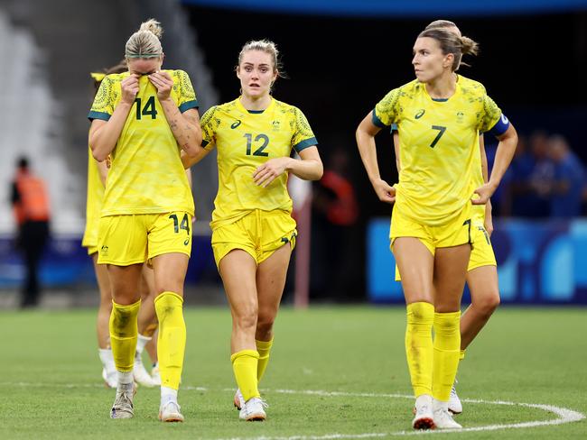 Alanna Kennedy and the Matildas show their dejection after their early exit at the Olympic Games. Picture: Getty Images