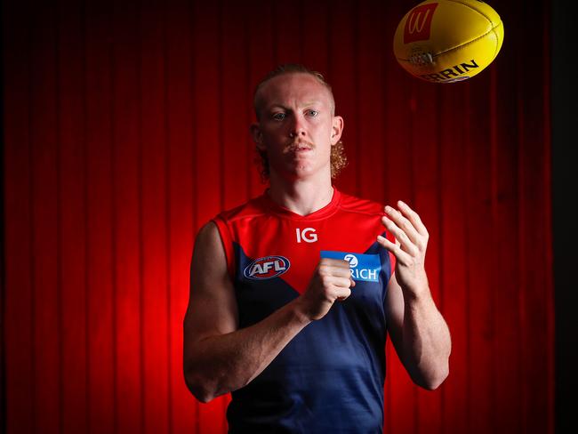 MELBOURNE, AUSTRALIA - FEBRUARY 27: Clayton Oliver poses for a photograph during the Melbourne Demons 2023 Official Team Photo Day at AAMI Park on February 27, 2023 in Melbourne, Australia. (Photo by Michael Willson/AFL Photos)