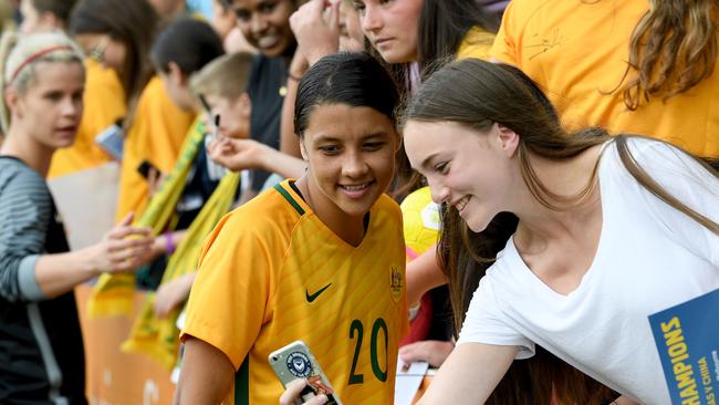 Sam Kerr of the Matildas gets a selfie with a fan