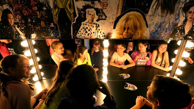 Students from Albert Park Primary School get a look at ' Romance Was Born' kids exhibition at the NGV in Melbourne.