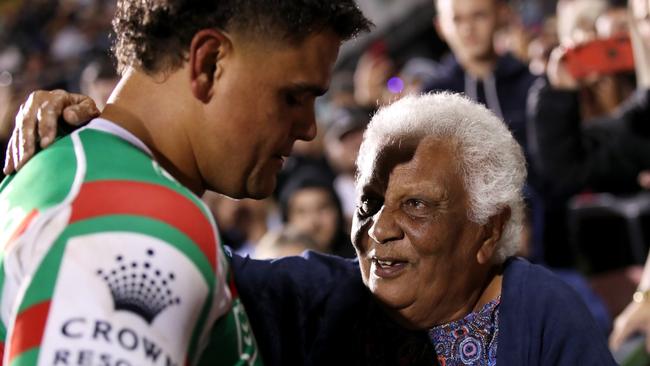 PENRITH, AUSTRALIA - APRIL 01: Latrell Mitchell of the Rabbitohs gives his boots to a supporter in the crowd during the round four NRL match between the Penrith Panthers and the South Sydney Rabbitohs at BlueBet Stadium, on April 01, 2022, in Penrith, Australia. (Photo by Matt King/Getty Images)