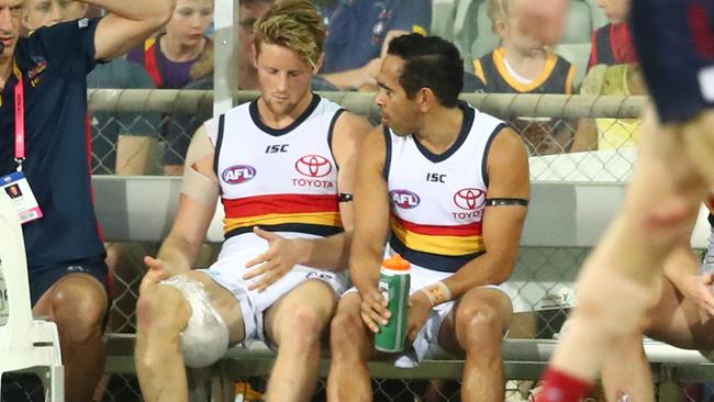 Adelaide’s Rory Sloane sits on the bench injured next to Eddie Betts in the round 11 match against the Melbourne Demons at TIO Stadium in Darwin. Picture: Scott Barbour/Getty