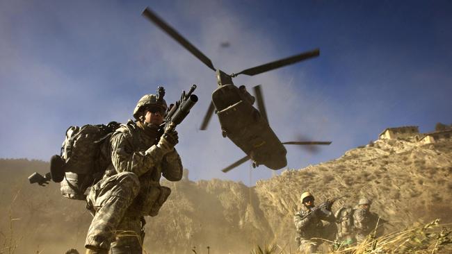 US and Afghan soldiers take up positions in Khost province on the Pakistan border in 2008. Picture: AFP