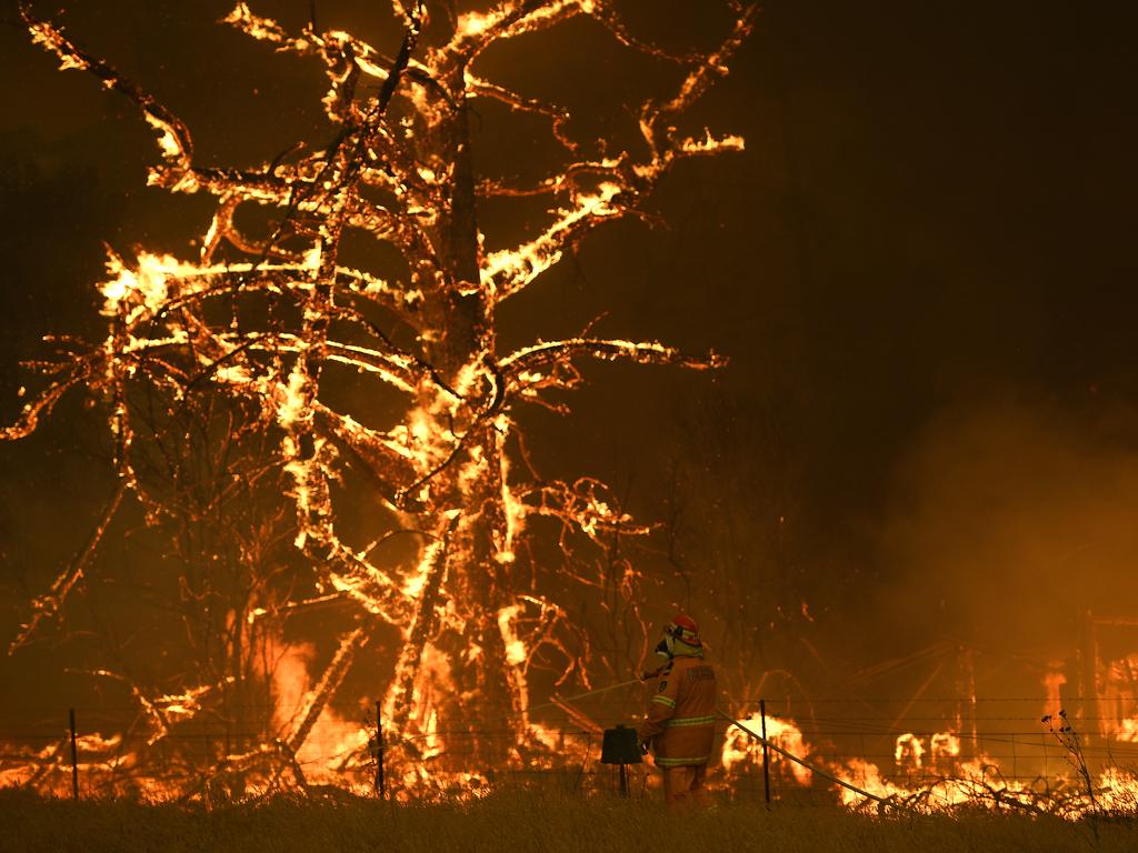 NSW Rural Fire Service crews fight the Gospers Mountain Fire as it impacts a property at Bilpin, Saturday, December 21, 2019. Conditions are expected to worsen across much of NSW as temperatures tip 40C. Picture: AAP / Dan Himbrechts