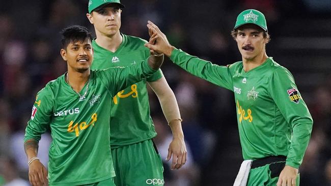 Sandeep Lamichhane celebrates one of his two wickets. Picture: AAP