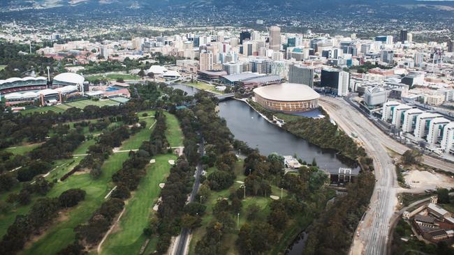 An aerial rendering of the planned new multipurpose arena alongside the other entertainment and events venues, and biomedical precinct buildings, on North Terrace.