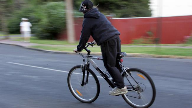 A man caught riding without a helmet led police to the discovery of thousands in stolen goods. (Person pictured is not the offender).