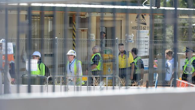 Police, ambulance officers and construction workers at the new Royal Adelaide Hospital site on Saturday, after Steve Wyatt was killed.