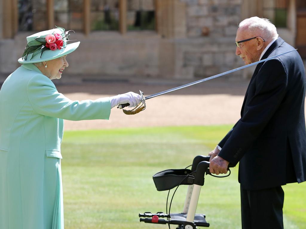 The Queen used the sword that belonged to her father, George VI as she confers the Honour of Knighthood on Captain Tom Moore at Windsor Castle. Photo by Chris Jackson / POOL / AFP)