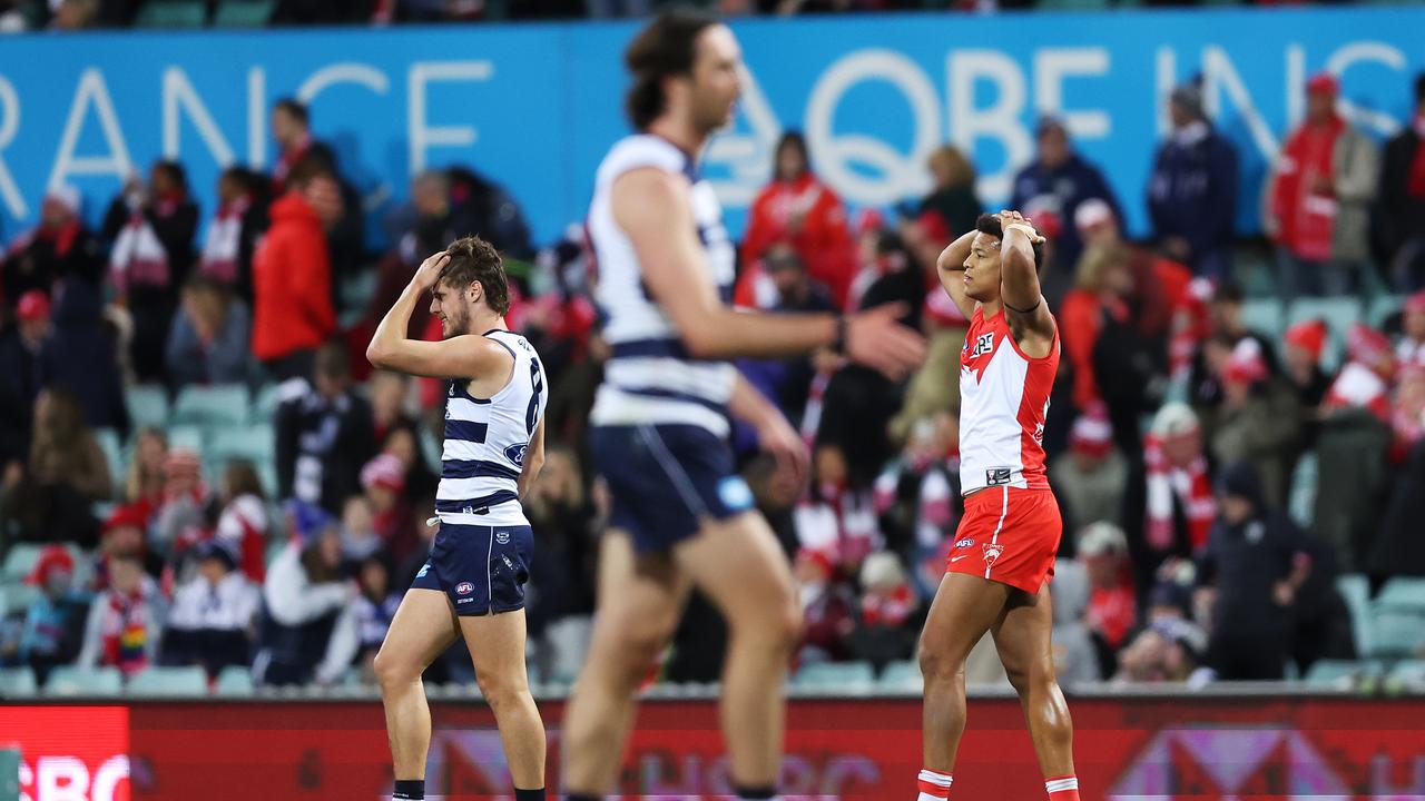 SYDNEY, AUSTRALIA - JUNE 30: Joel Amartey of the Swans and Jake Kolodjashnij of the Cats react on the final buzzer following a draw during the round 16 AFL match between Sydney Swans and Geelong Cats at Sydney Cricket Ground, on June 30, 2023, in Sydney, Australia. (Photo by Mark Metcalfe/AFL Photos/via Getty Images)