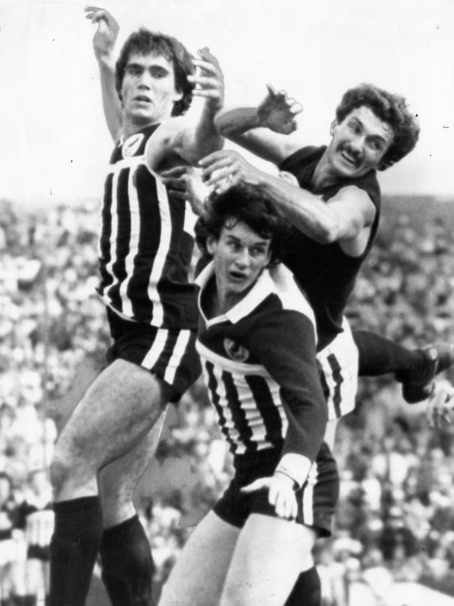 SANFL Football - Port Adelaide vs South Adelaide Grand Final match at Football Park, West Lakes, 30 Sep 1979. (L-r) Port's Greg Phillips and Robert Dolan complete with South's Andy Bennett. (Pic by unidentified staff photographer)