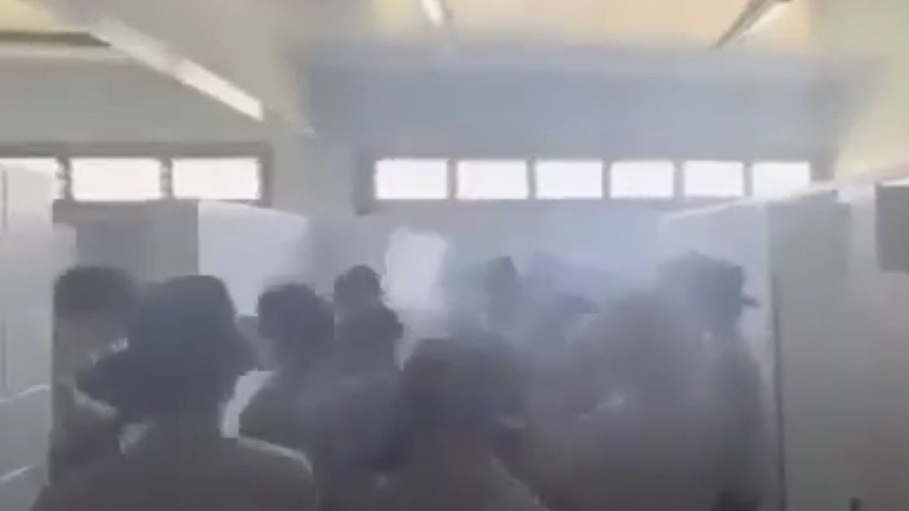 The video shows the Emmaus College Rockhampton vaping in a toilet block and using profane language such as “f***” and “c***”.
