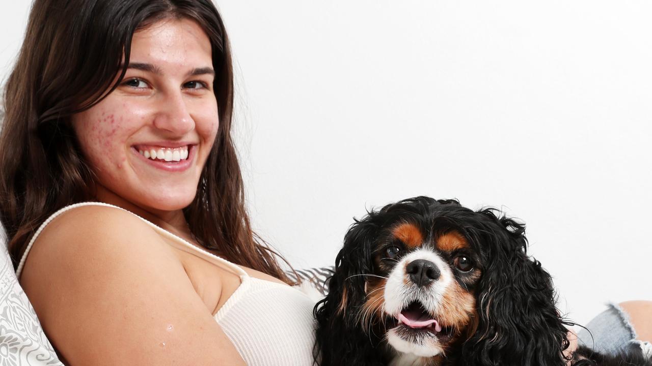 Aleesha Naxakis, 22, from Roselands sleeps with her dog Benji, a King Charles cavalier. For a story on women that sleep with a dog get a better night's sleep. Picture: Jonathan Ng