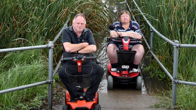 Craigieburn residents Russell Poulton and Laurence Hubbard couldn’t use the ford crossing last April due to flooding. Picture: Kylie Else