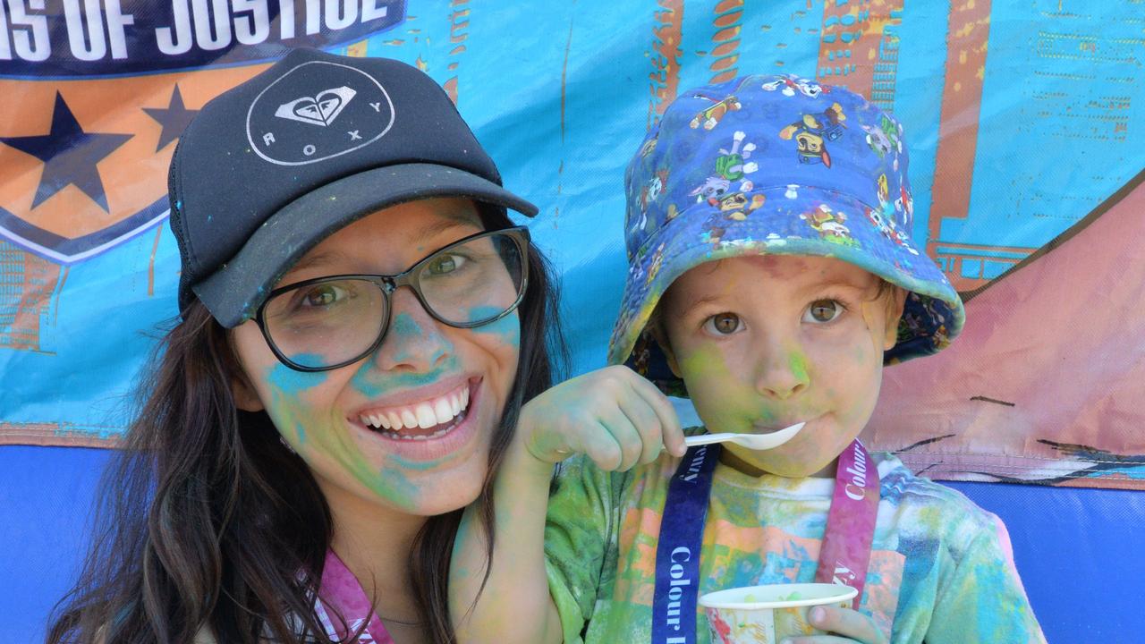 Slade Point resident Rebecca Van De Wetering and Dylan Walton, 3, enjoying an ice cream after the Mackay Colour Frenzy in John Breen Park.