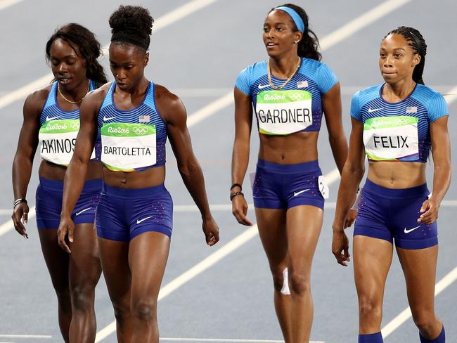 RIO DE JANEIRO, BRAZIL - AUGUST 18: Morolake Akinosun, Tianna Bartoletta, English Gardner and Allyson Felix of the United States celebrate after the round one Women's 4 x 100m Relay Re-Run on Day 13 of the Rio 2016 Olympic Games at the Olympic Stadium on August 18, 2016 in Rio de Janeiro, Brazil. (Photo by Paul Gilham/Getty Images)