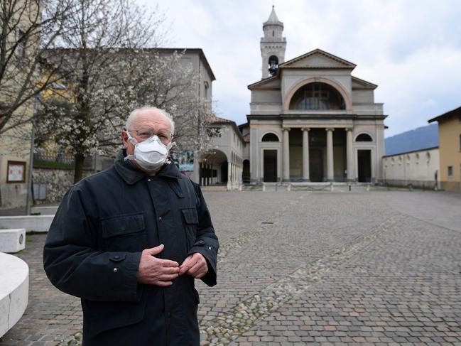 Italian priest, Don Giuseppe Locattelli, was charged with blessing the many dead in a northern region of the country that has been hardest hit by the coronavirus. Picture: AFP