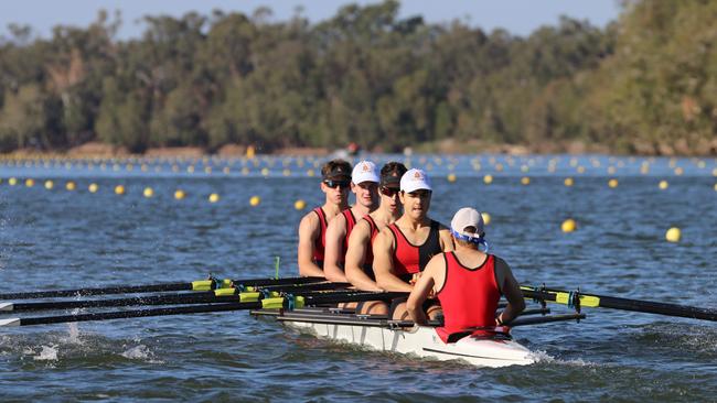 A Rockhampton Grammar crew prepare for the Queensland Secondary Schools Rowing Championships on the Fitzroy River.