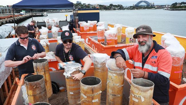 New Year’s Eve fireworks supremo Fortunato Fonti, right, oversees the final preparations for what he promises will be a spectacular midnight show on Sydney Harbour. Picture: John Feder