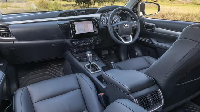 The SR5 has wireless charging and USB-C outlets, but no digital dashboard. Photo: Toyota