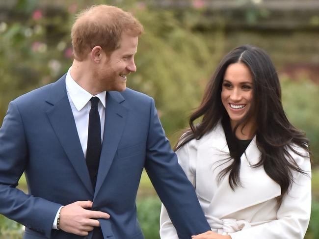 Prince Harry and Meghan Markle in the Sunken Garden at Kensington Palace, London, after the announcement of their engagement.. Picture date: Monday November 27, 2017. The much-anticipated news was confirmed by the Prince of Wales in a brief statement issued by Clarence House. See PA story ROYAL Wedding. Photo credit should read: Dominic Lipinski/PA Wire