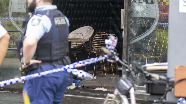 Police and Fire Rescue NSW clean the scene of where Comanchero bikie Tarek Zahed and brother Omar were shot. Picture: Liam Mendes / The Australian