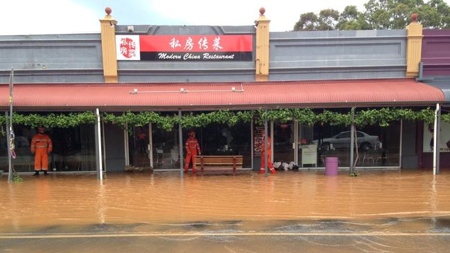 Shops are at risk of damage from water rushing out of a burst water main on Good Rd. Picture: Mitch Mott