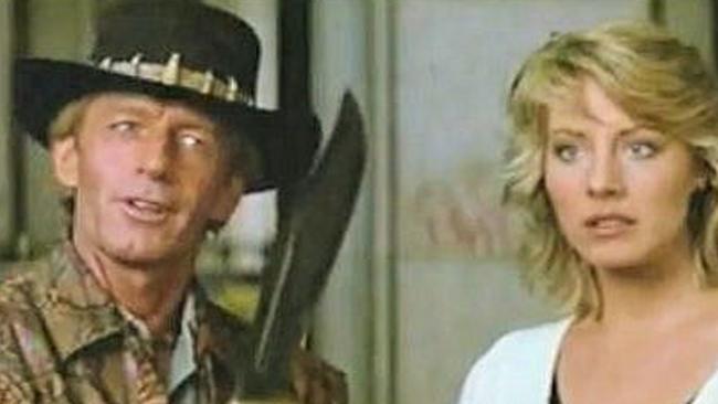 Mick Dundee in the scene from the film Crocodile Dundee when he pulls out his massive hunting knife with the same line.