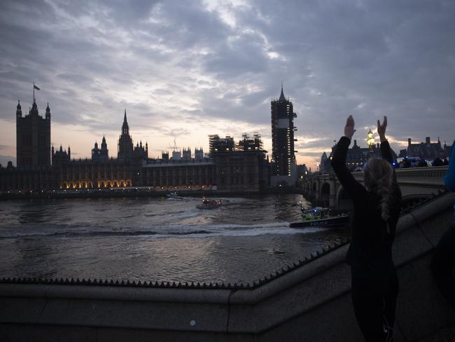 A woman clapping for medical workers. Picture: Matt Dunham