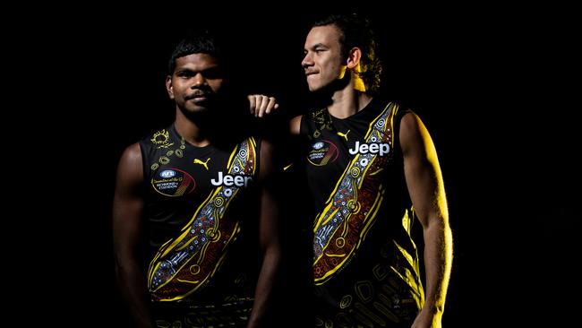 Maurice Rioli Jnr and Daniel Rioli pose wearing the Tigers’ 2021 Indigenous guernsey. Picture: Darrian Traynor/Getty Images