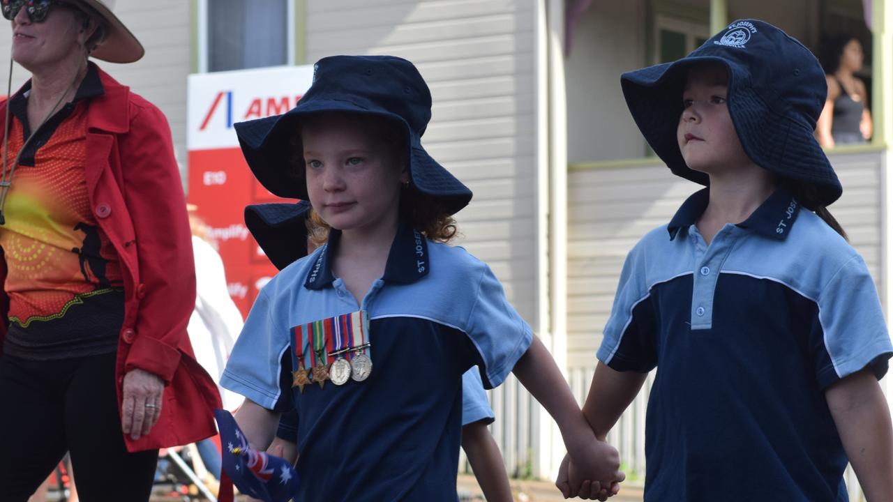 Young students from St. Joseph's Primary School in Alstonville join the march during the ANZAC DAY parade on Main Street in Alstonville Picture: Nicholas Rupolo.