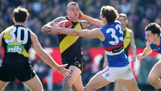 Dustin Martin shrugs off Aaron Naughton. Picture: Michael Klein