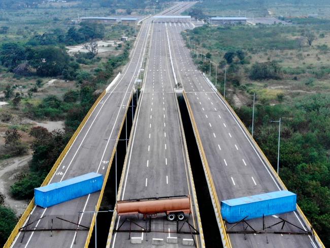 Aerial view of the Tienditas Bridge, in the border between Cucuta, Colombia and Tachira, Venezuela, after Venezuelan military forces blocked it with containers. Venezuelan military officers blocked a bridge on the border with Colombia ahead of an anticipated humanitarian aid shipment, as opposition leader Juan Guaido stepped up his challenge to President Nicolas Maduro's authority. Picture: AFP