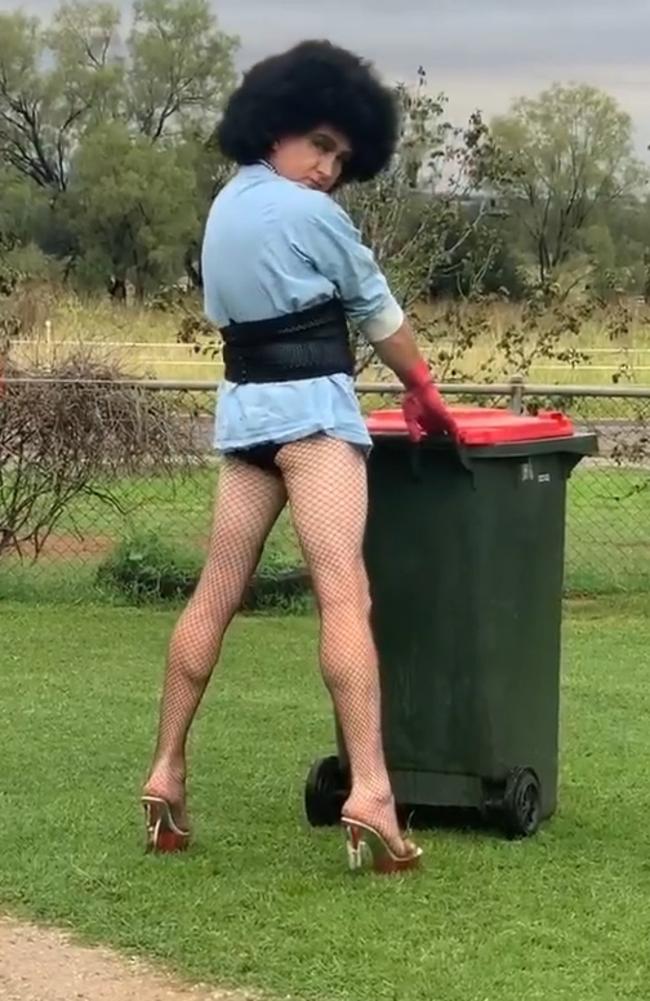 Tamworth horse trainer Damien Judd takes his bin out as Frank N Furter from the Rocky Horror Picture Show.