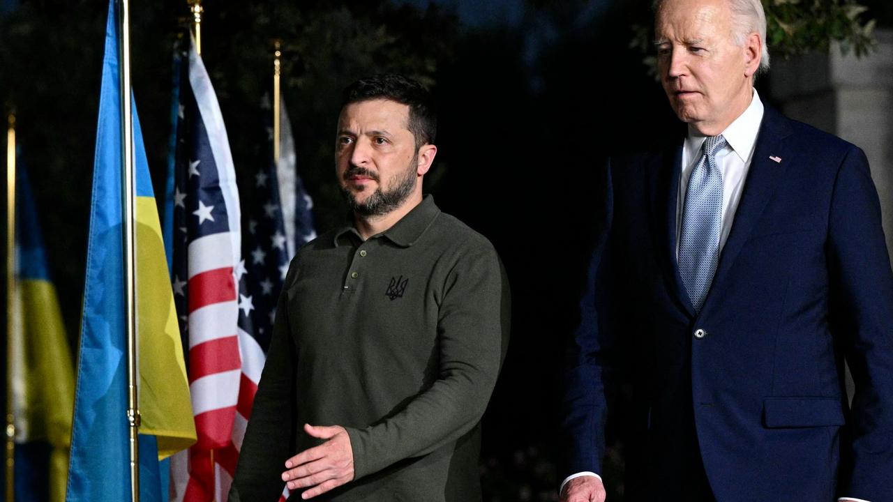 US President Joe Biden and Ukrainian President Volodymyr Zelensky arrive to sign a bilateral security agreement at the Masseria San Domenico on the sidelines of the G7 Summit. (Photo by Mandel NGAN / AFP)