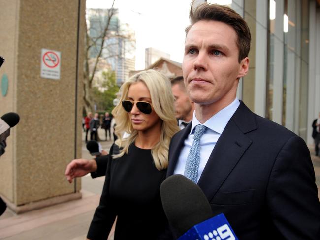 Stockbroker Oliver Curtis leaves court with his wife Roxy Jacenko. Picture: AAP Image/Joel Carrett.