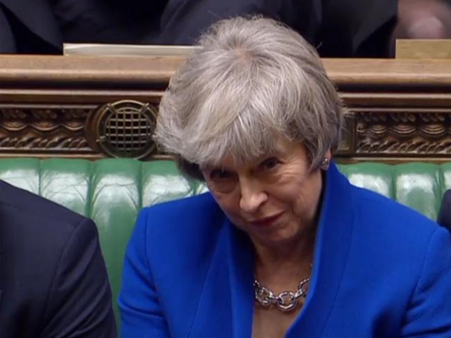 A video grab from footage broadcast by the UK Parliament's Parliamentary Recording Unit (PRU) shows Britain's Prime Minister Theresa May reacting as opposition Labour Party Leader Jeremy Corbyn makes a point of order after the result of the vote on the no confidence motion, in the House of Commons in central London on January 16, 2019. - British Prime Minister Theresa May on Wednesday survived a no-confidence vote sparked by the crushing defeat of her Brexit deal just weeks before the UK leaves the European Union. (Photo by HO / PRU / AFP) / RESTRICTED TO EDITORIAL USE - MANDATORY CREDIT " AFP PHOTO / PRU " - NO USE FOR ENTERTAINMENT, SATIRICAL, MARKETING OR ADVERTISING CAMPAIGNS