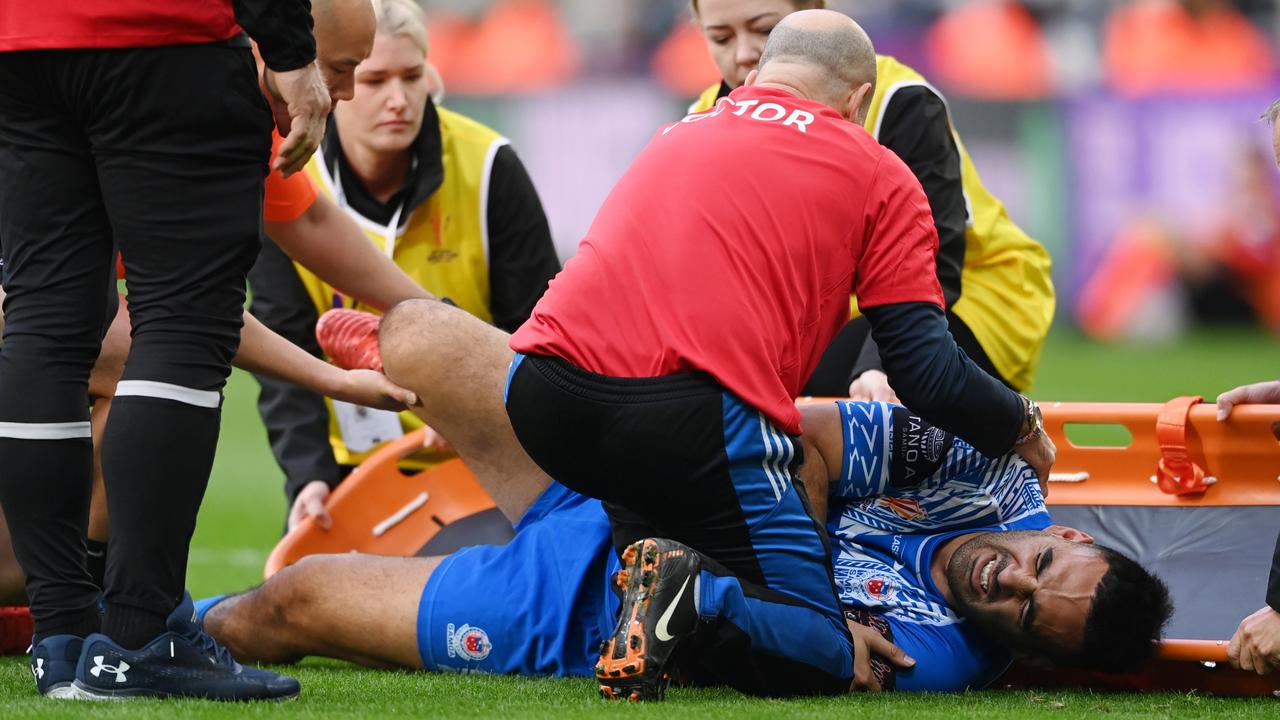 Tyrone May in agony on the field after dislocating his hip. Picture: Getty