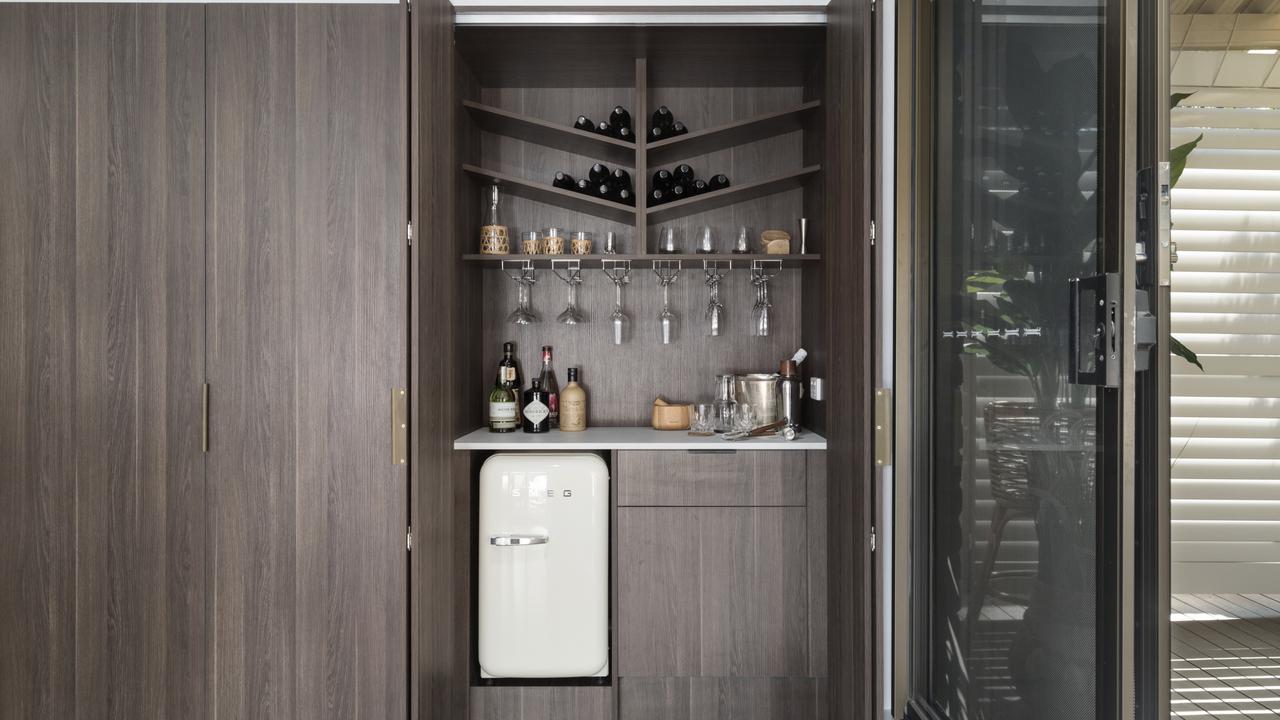 AFTER: There is a bar hidden in one of the kitchen cabinets.