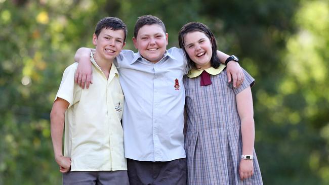 Toby Martin pictured centre with siblings Archer and Holly. Picture: Sue Graham