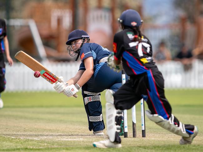 Eve Burke sweeps past Reet Kumar. Picture: Julian Andrews